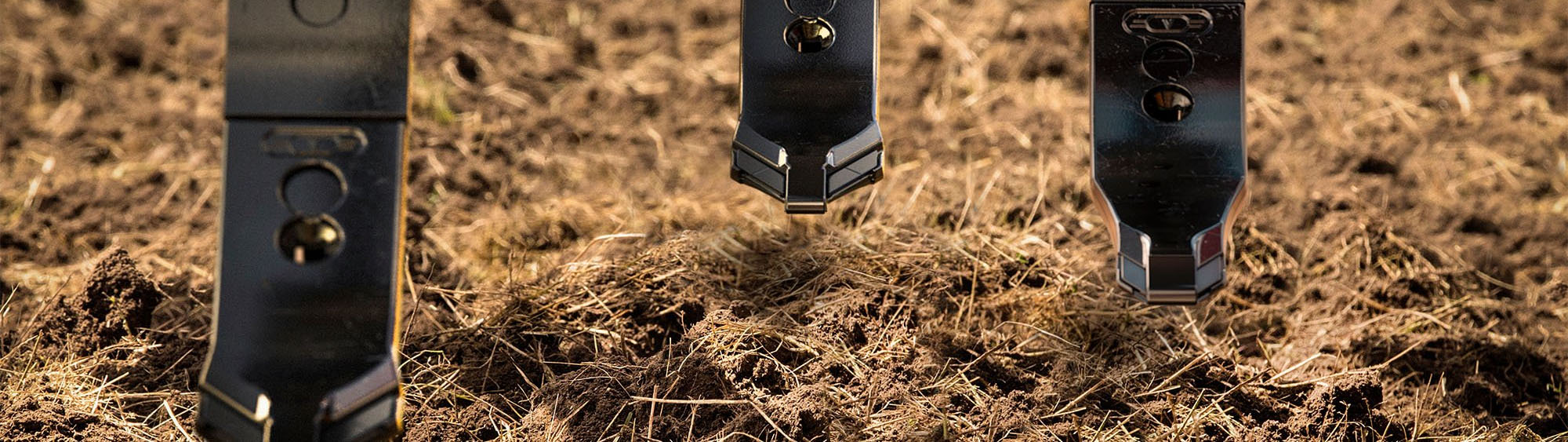 Close-up of Väderstad Marathon Edge points on a machine standing in a field