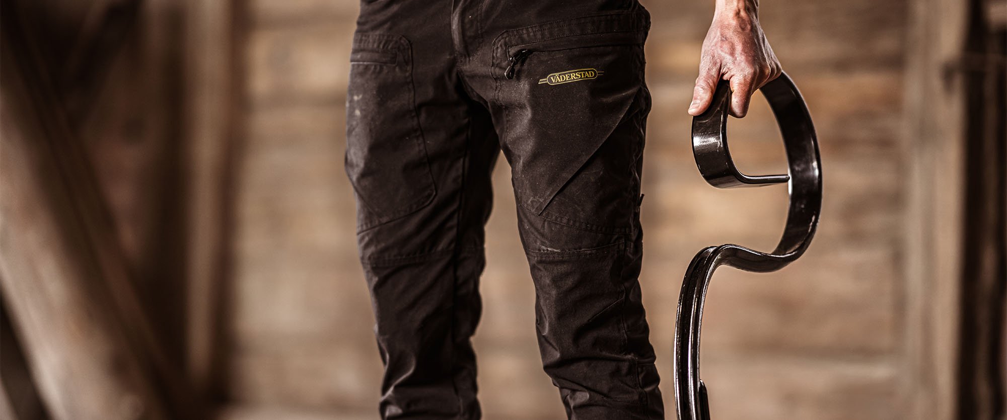 Close-up of someone holding a Väderstad tine in their hand.