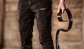 Close-up of someone holding a Väderstad tine in their hand.