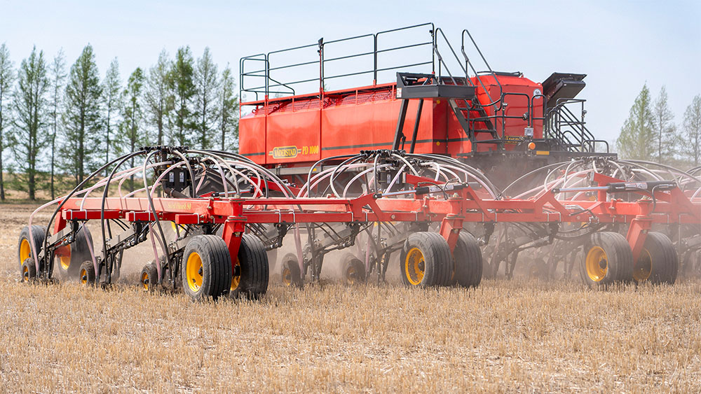 Väderstad Seed Hawk air seeder 80 and Precision Delivery air cart 1000 in a field