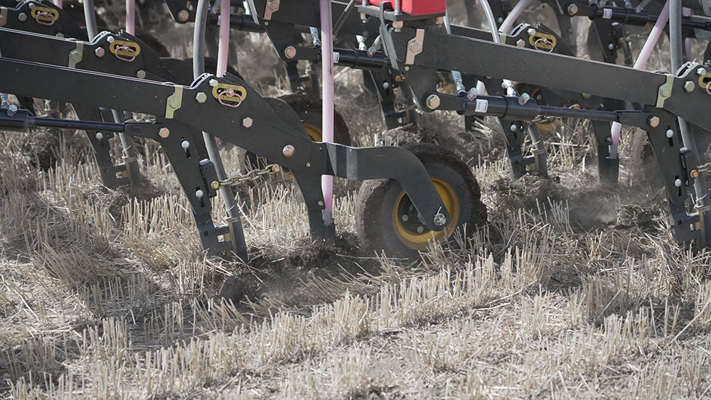 Close-up photo of Seed Hawk coulters in the ground