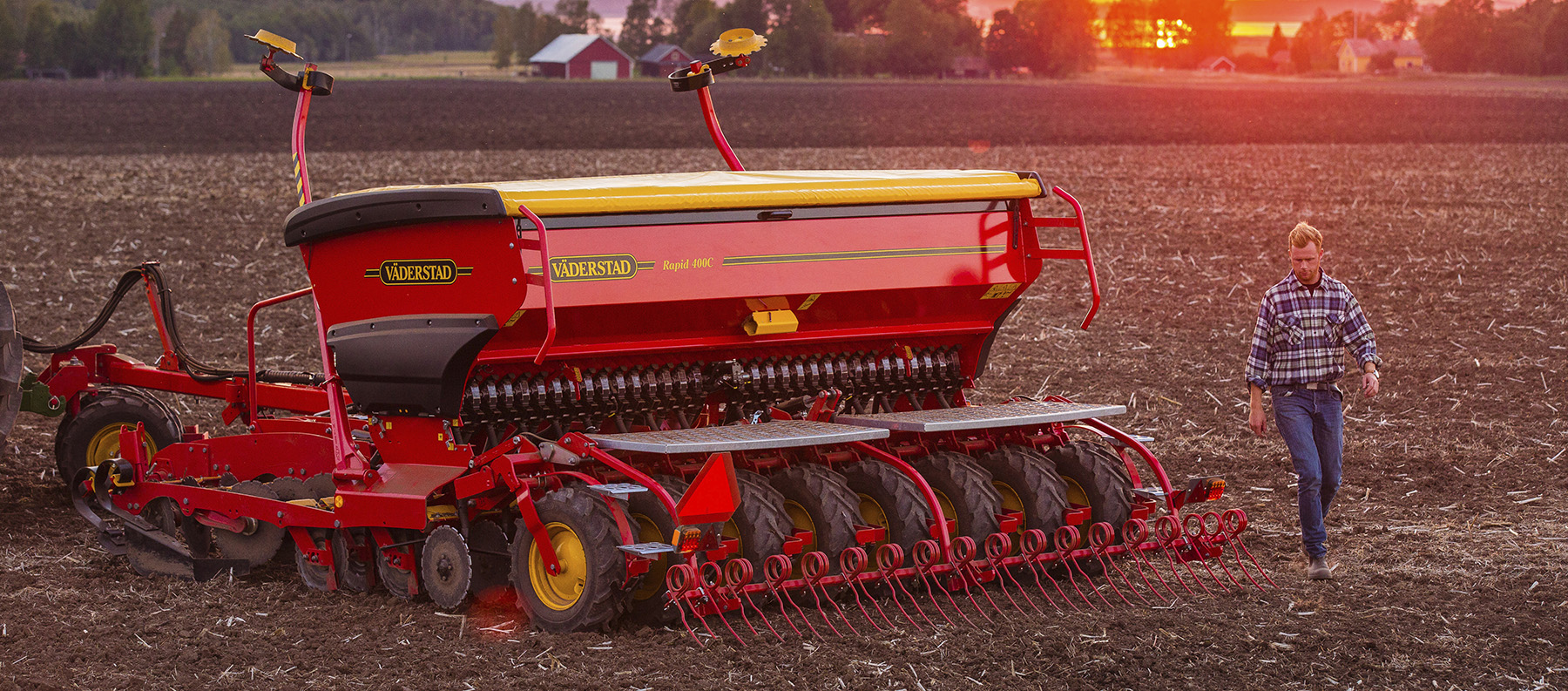 Farmer behind a Rapid 400C in field