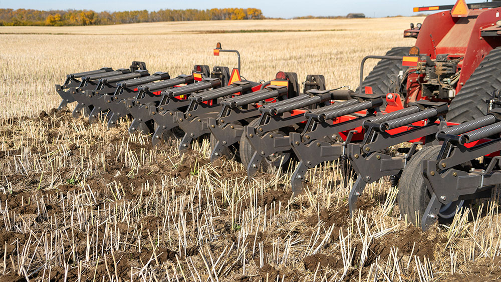 Wil-Rich 357 Inline Ripper working the soil
