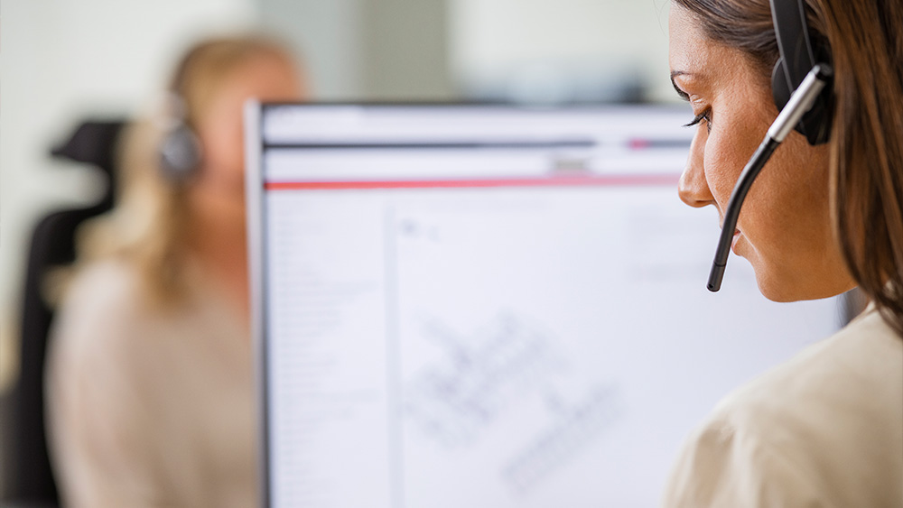 Woman sitting behind computer